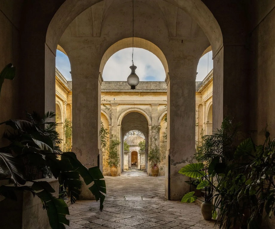 Bare frescoed hall of a nineteenth-century palace in Puglia with almost no furniture