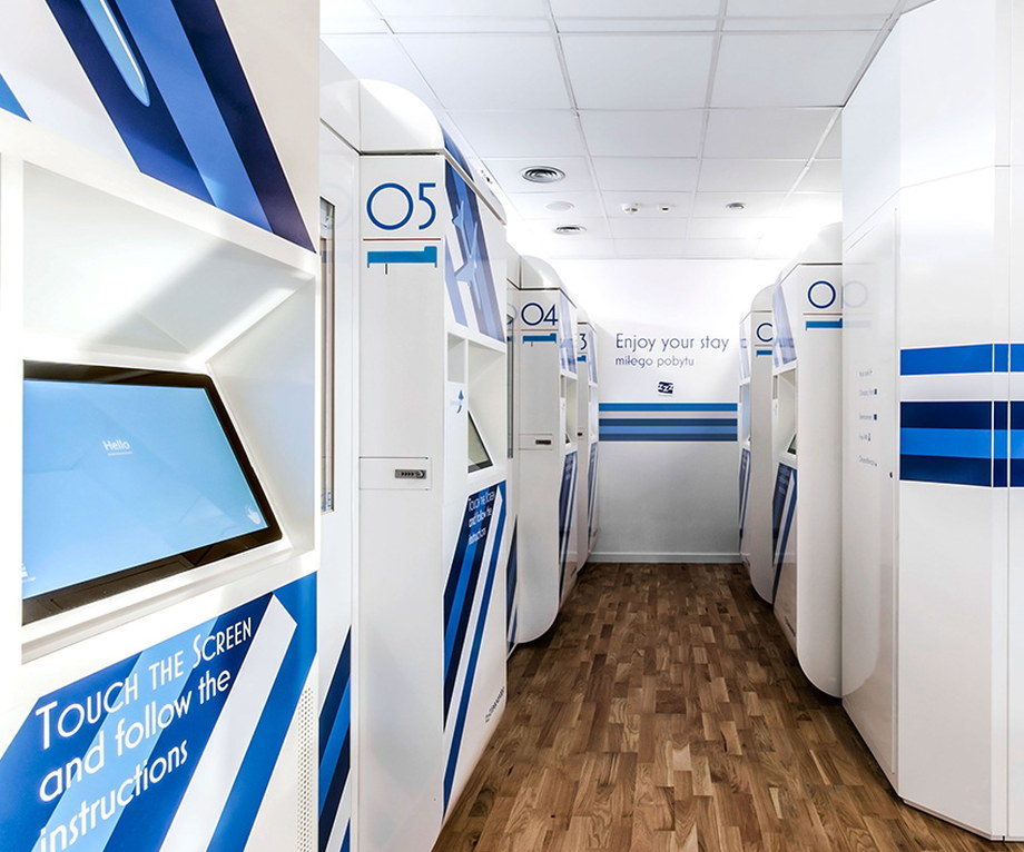 Sealed sleeping cabin inside an airport terminal with an interior wall and no window